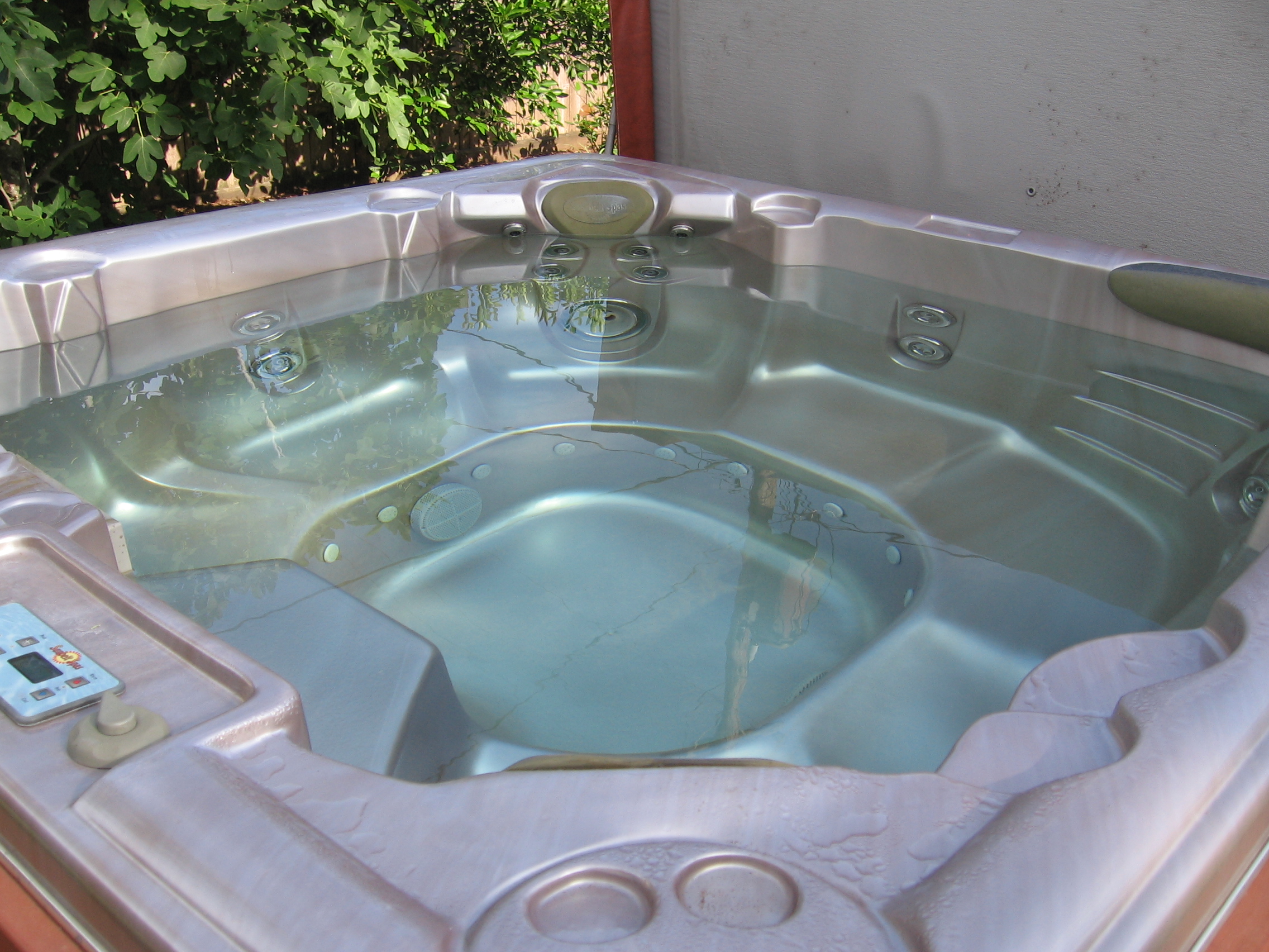 Person Sunbelt Wave Spa Hot Tub Hot Tub Insider